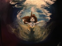 a painting of a mermaid under water